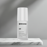 White bottle labeled 'Elemental' on a gray background