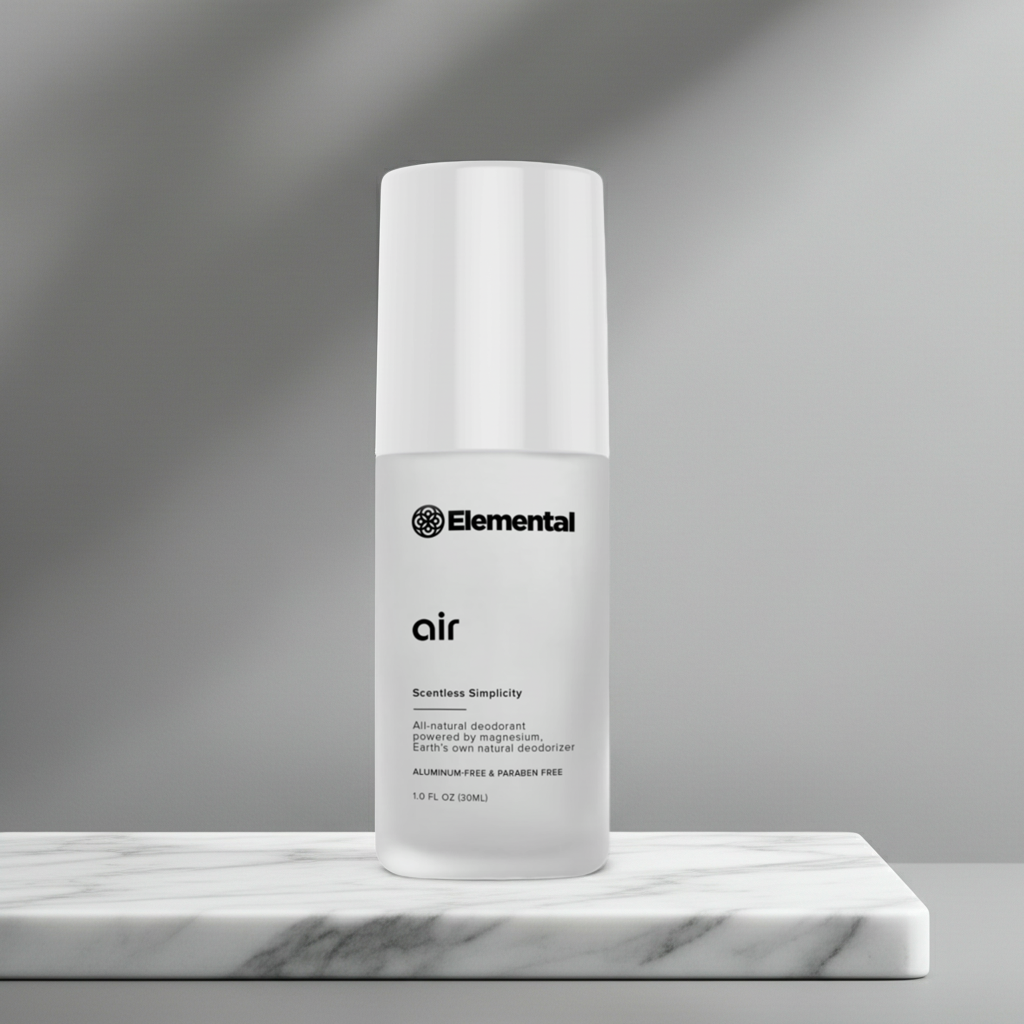 White bottle labeled 'Elemental' on a gray background